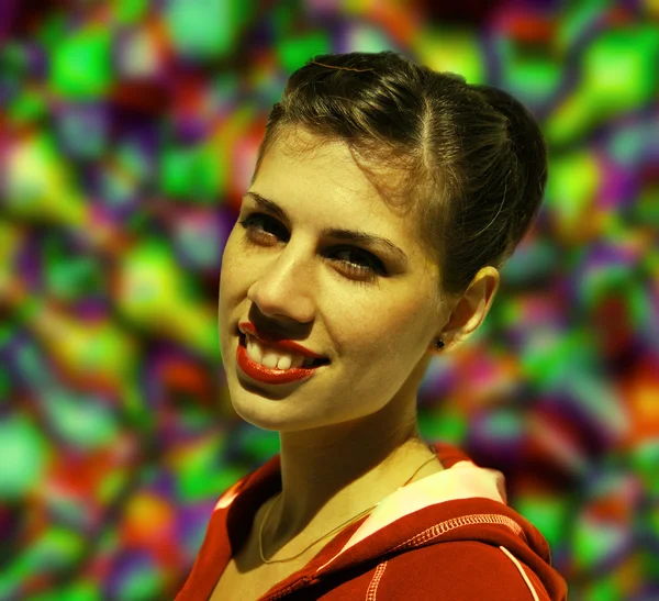 Portrait of young woman on a colored background