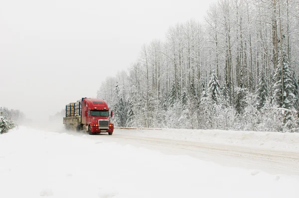 Red truck on winter road