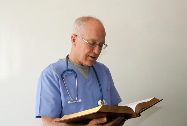 Doctor reading bible