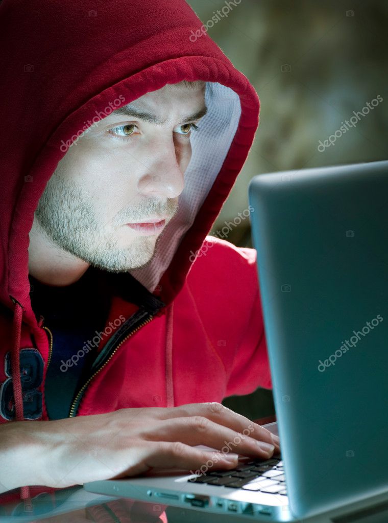 Hacker. Man With Computer In A Dark Room— Photo by Subbotina - depositphotos_10604986-Hacker-man-with-computer-in