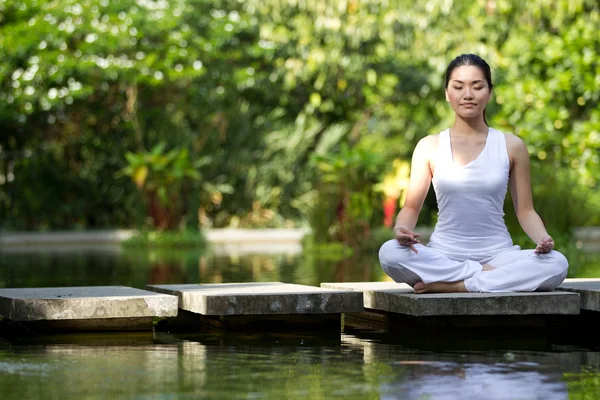 Asian Woman performing yoga