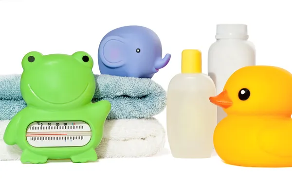 Baby bath accessories isolated: towels, toys, thermometer and bo