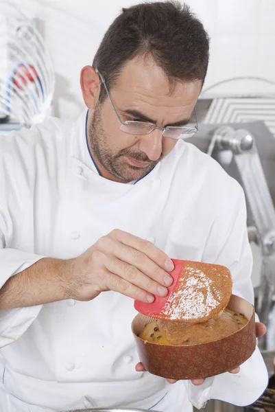Confectioner prepares the panettone for the cooking