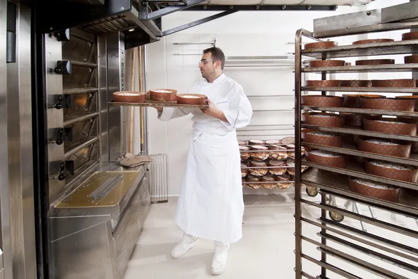 Pastry Chef, takes away the panettone baked of the oven