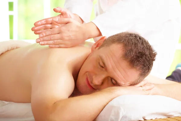Man enjoying massage treatment