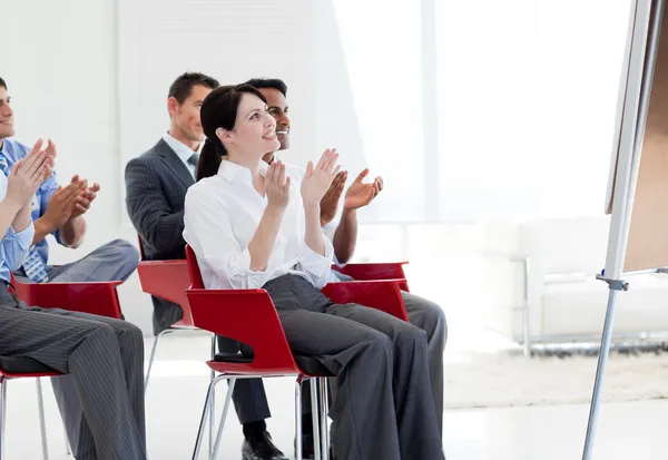 Multi-ethnic business clapping at the end of a conference