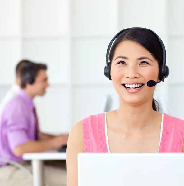 Laughing Customer service representative using headset