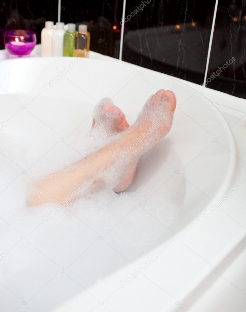 Woman's feet in a bubble bath — Stock Photo © Wavebreakmedia 10282422