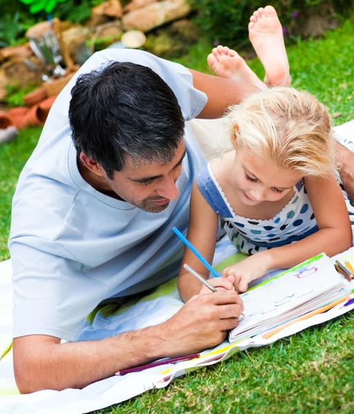 Dad and daughter painting in a garden
