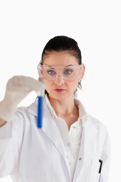 Dark-haired scientist conducting an experiment