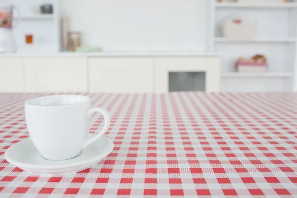 A cup of tea on a tablecloth