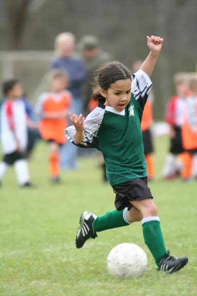 Young Girl Playing Soccer