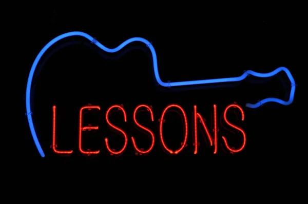 Guitar Lessons Neon Sign