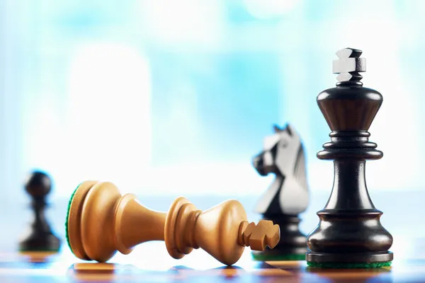 White king wins chess game sepia tone