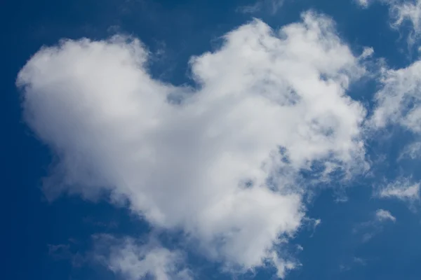 Real heart from clouds on the blue sky