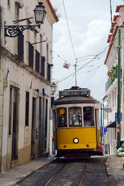 Yellow Tram in narrow street