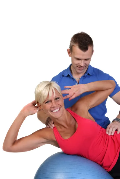 Attractive woman with her fitness coach