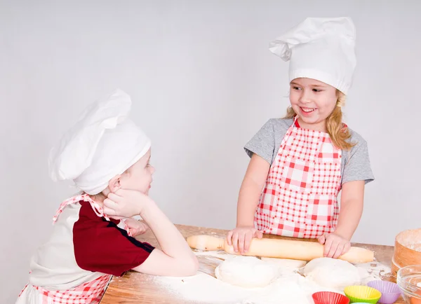 stock image Girl and boy in chef's hats