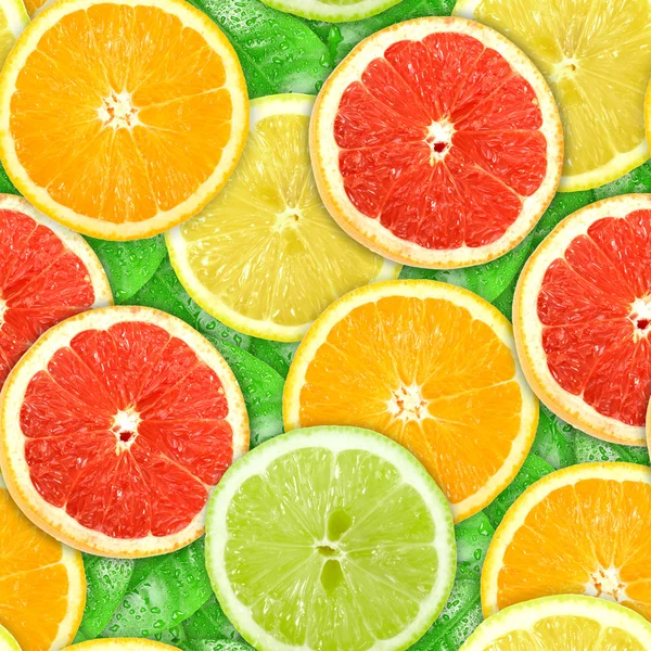 Seamless pattern with motley citrus-fruit slices — Stock Photo, Image