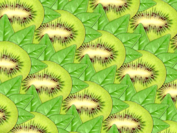 Achtergrond van verse kiwi segmenten en groen blad — Stockfoto