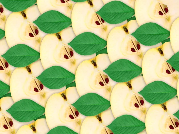 Фон зі шматочків яблук і зеленого листя — стокове фото