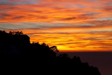 Beautiful sunset in Crimea rocks clipart
