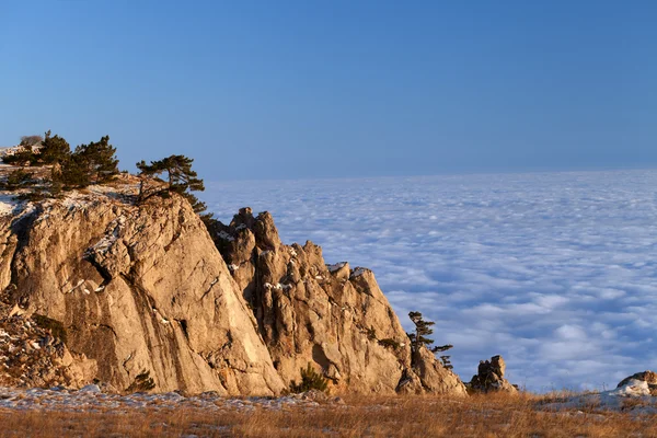 stock image Mountains at sunset and sea in clouds