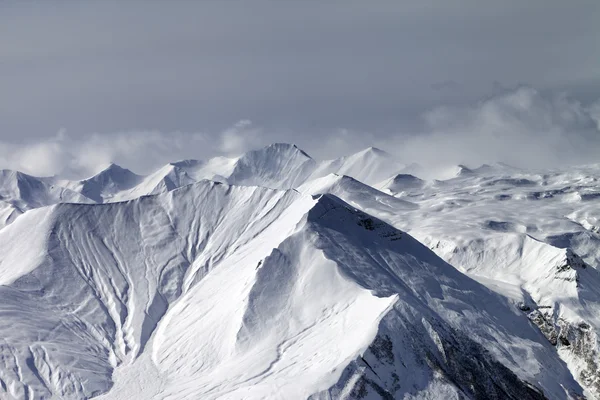 Snowy mountains in haze — Stock Photo, Image