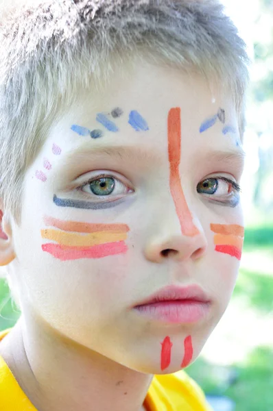 Boy with football paintings on face — Stock Photo, Image