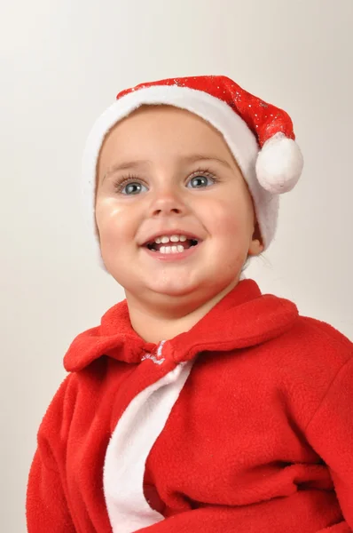 Santa kisgyermek lány mosolyogva — Stock Fotó