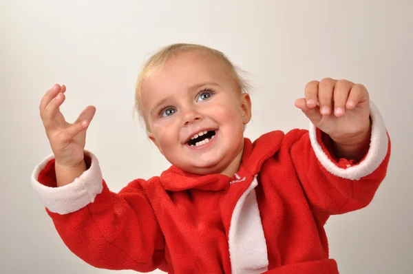 Happy Christmas baby with hands raised — Stock Photo, Image