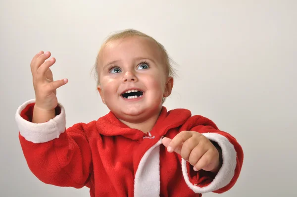 Santa kisgyermek lány mosolyogva — Stock Fotó