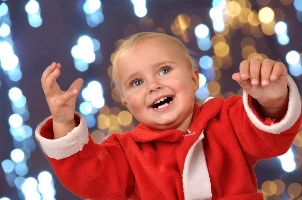 Glad jul barnet med händerna upp — Stockfoto
