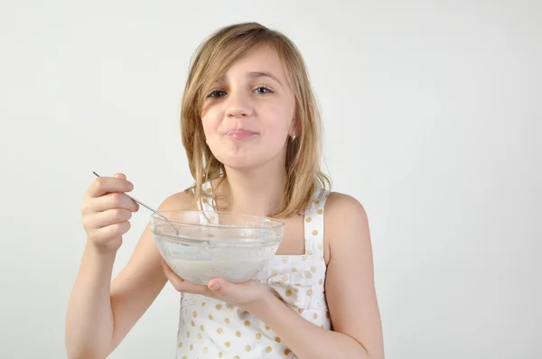Child with a bowl of milk porridge — Stock Photo, Image