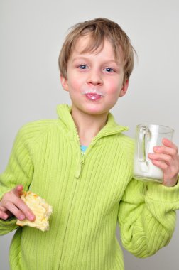 Child having lunch clipart