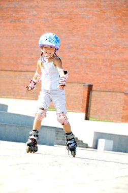 Child on inline rollerblade skates clipart