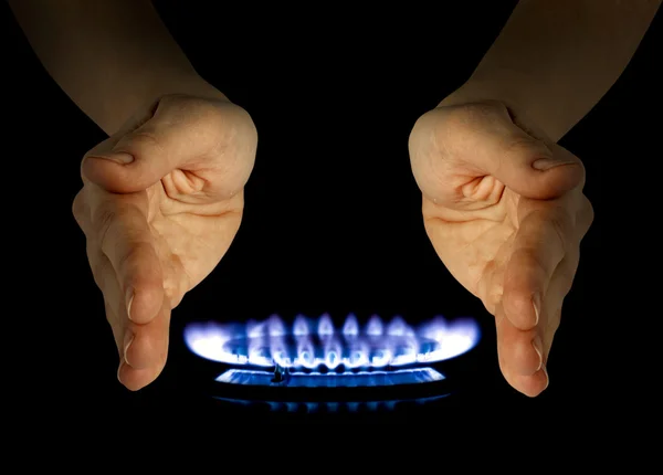 Blue gas in hands on the black — Stock Photo, Image