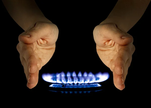 stock image Blue gas in hands on the black