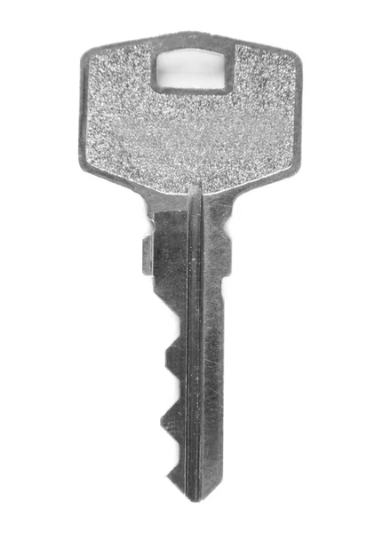 Ένα γκρι κλειδί σε λευκό φόντο — Φωτογραφία Αρχείου