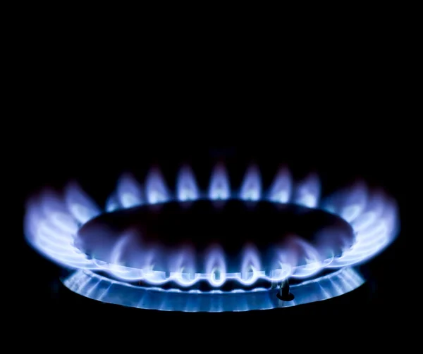 stock image Blue gas stove in the dark