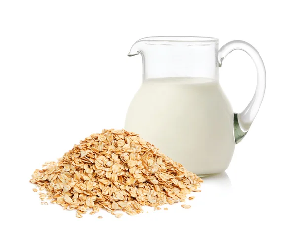 Oat flakes and milk — Stock Photo, Image