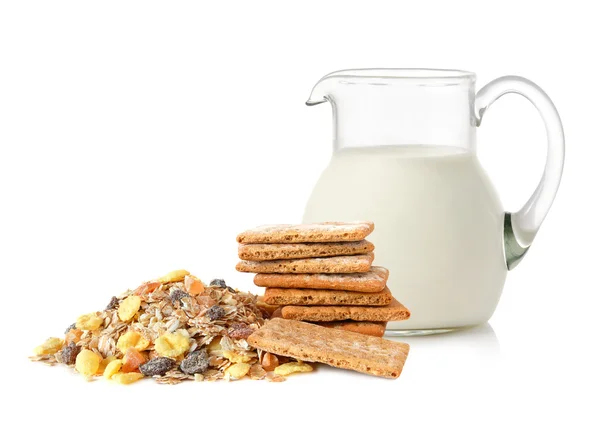 Glass jug with milk, cracker and muesli — Stock Photo, Image
