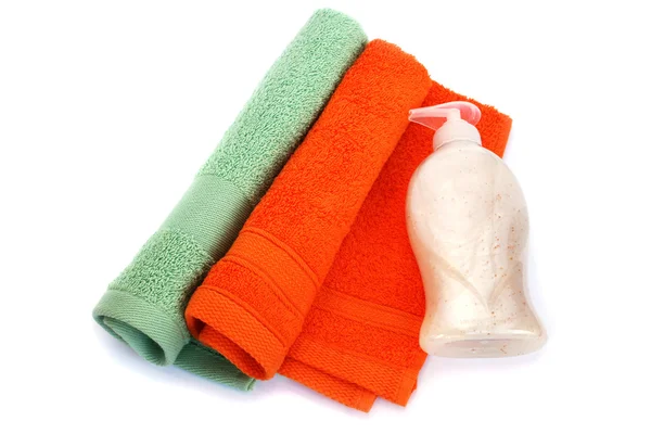 Towels and liquid soap bottle — Stock Photo, Image
