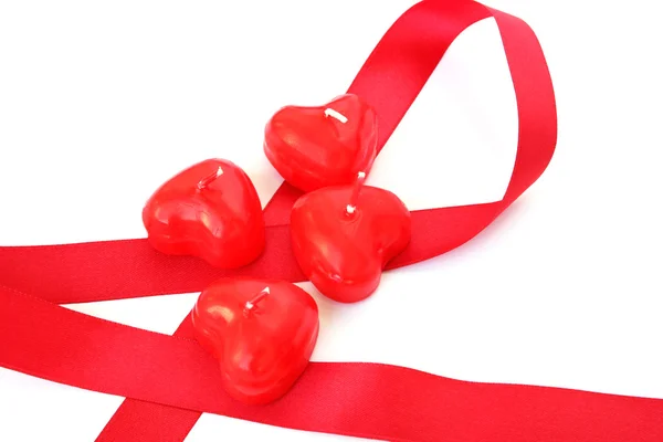 Red candles and ribbon — Stock Photo, Image