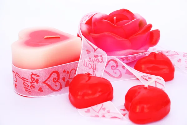 Red candles and ribbon — Stock Photo, Image