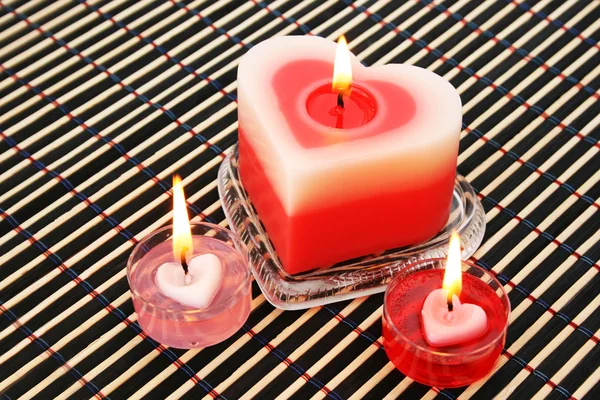 Červené a růžové svíčky — Stock fotografie