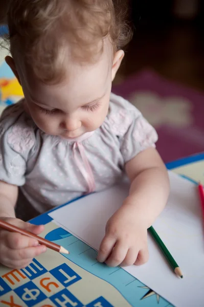 Baby drawing with pencils — Stock Photo, Image
