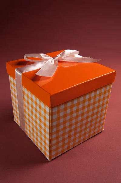 Present box on textile background — Stock Photo, Image