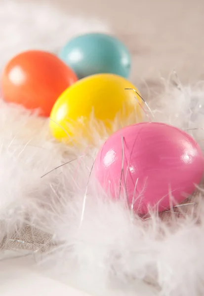 Colorfull Easter eggs on feather background Stock Picture
