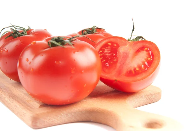 Stock image Tomatoes on wooden board